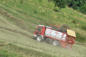 Doucy combelouvière : domaine de valmorel en été, camion ramassant le foin