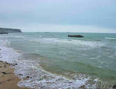 Arromanches vue sur les ruines du port artificiel